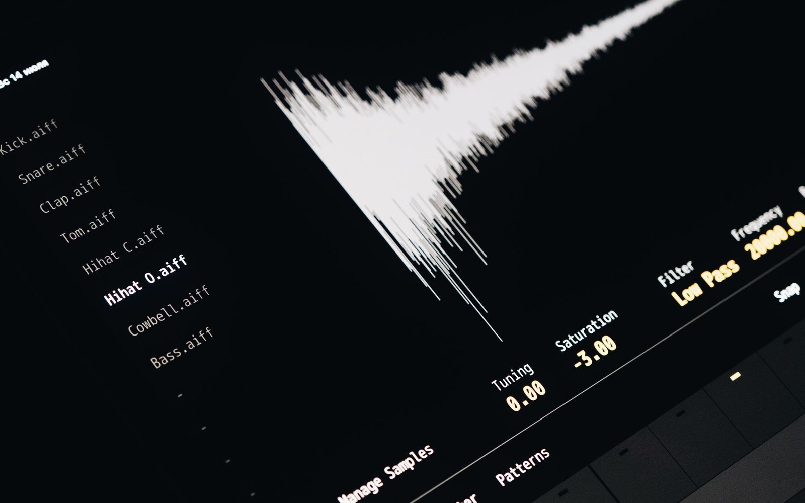 Waveform display and drum sample list on a music production software interface