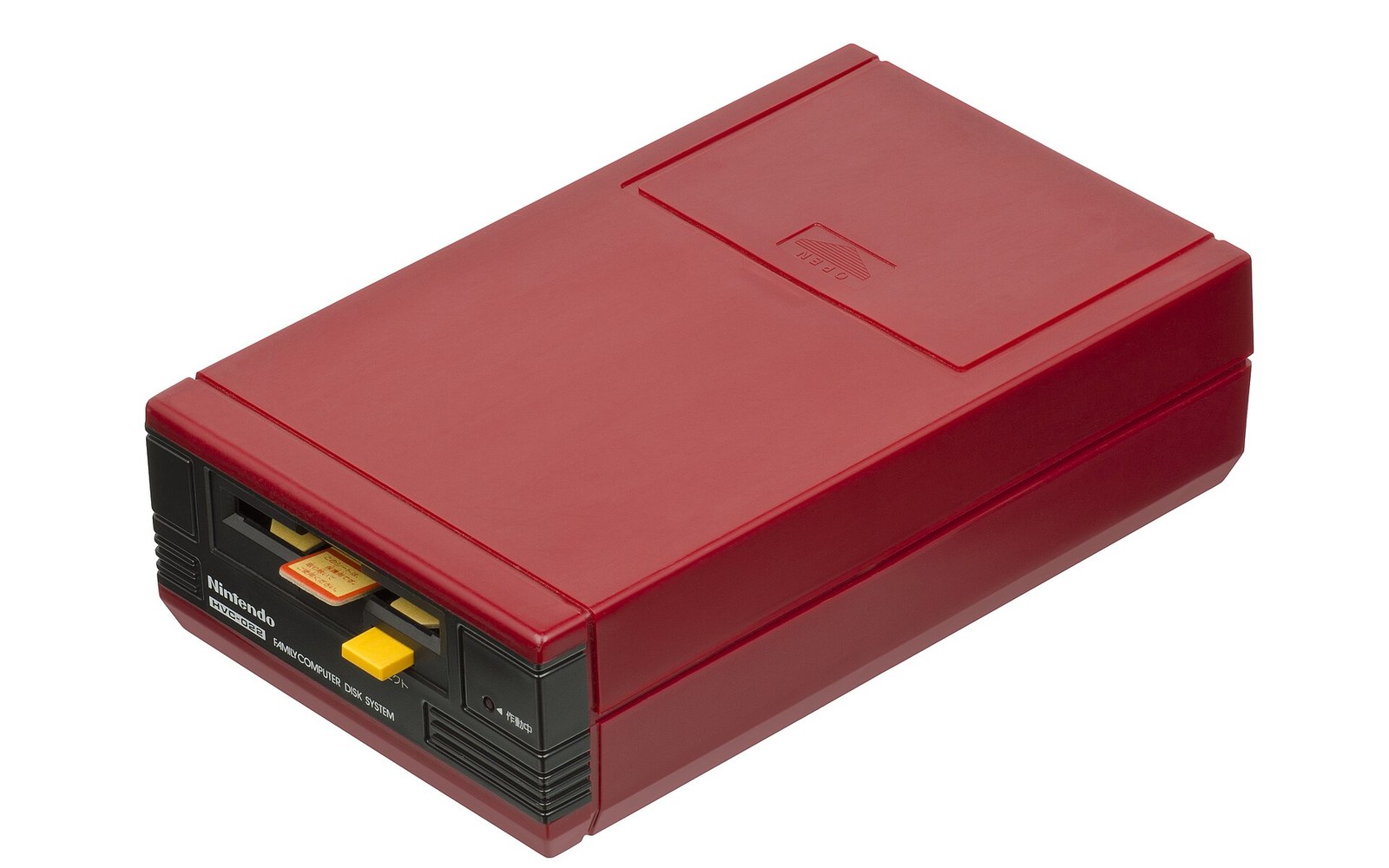 Nintendo Famicom Disk System console, a red plastic drive unit with a disk slot